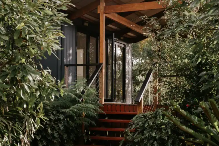A-cabin-surrounded-by-trees.webp
